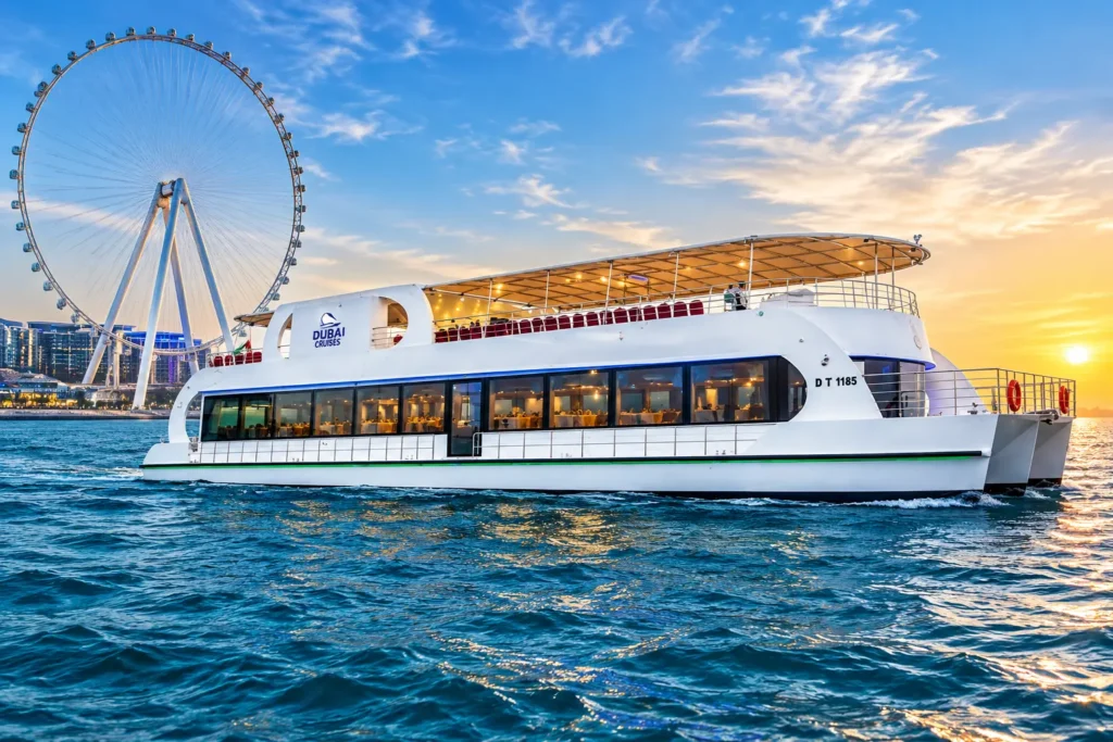 Premium luxury yacht with covered upper deck cruising in Dubai Marina at sunset